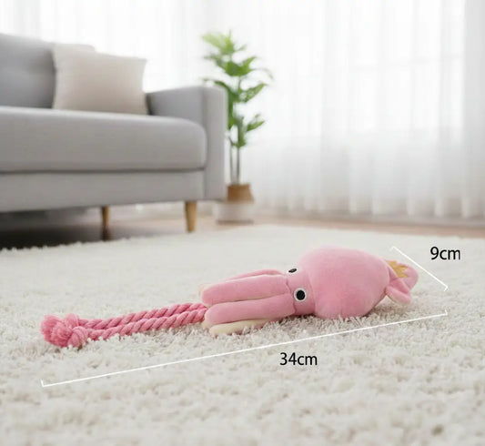 Jouet dentaire chien peluche en forme de poulpe posé au sol avec dimensions visibles, texture douce adaptée à la dentition des chiens et chiots et à la mastication légère